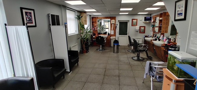Noddys Barber Shop Showing Interior View With Waiting Area And Barbers Chairs